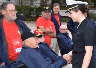 Veteran shaking hands with a navy cadet from Nipomo