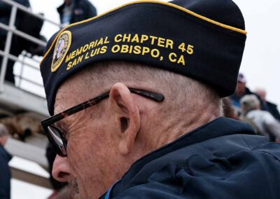 Veteran proudly wearing their American Legion Post hat during an Honor Flight event.